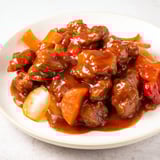 Tender pork chunks swimming in a rich, tangy sauce for this easy sweet and sour Sauerbraten.