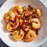 Spicy and savory Korean Garlic Butter Shrimp with sesame seeds and scallions, a delightful pescatarian meal.