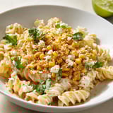 Enjoy a steaming plate of Mexican street corn pasta, a tasty vegetarian main course.