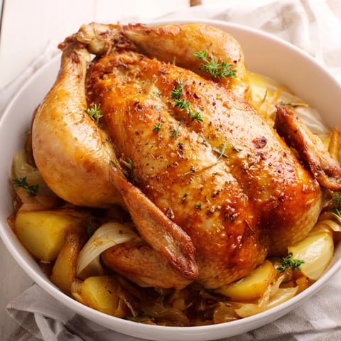 Tender Georgia Pot Roast Chicken, served with fluffy mashed potatoes, ready to eat.