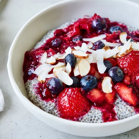 Creamy Berry Chia Pudding layered with vibrant red berries, a perfect make-ahead breakfast.