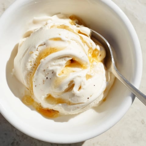 Creamy cottage cheese ice cream swirled with fresh berries, a cool and refreshing dessert.