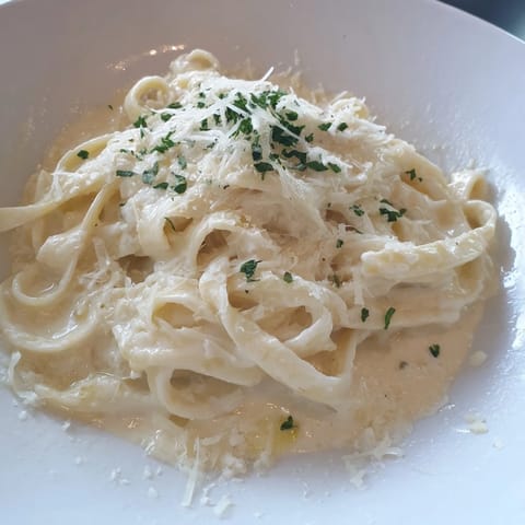 Smooth, blended Cottage Cheese Alfredo Sauce simmering in a pan, ready in minutes.