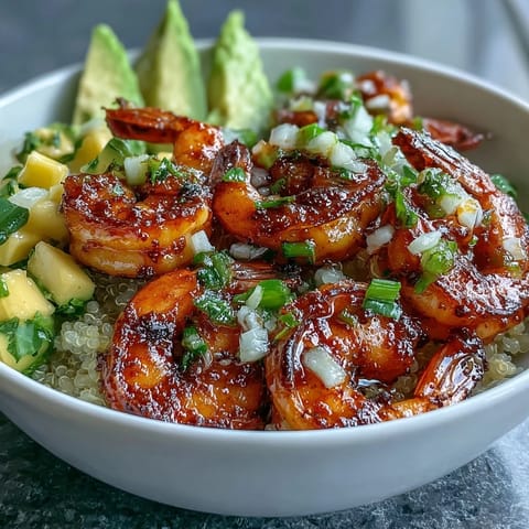 Smoky grilled shrimp, creamy avocado, and quinoa topped with juicy mango salsa and lime chili sauce.