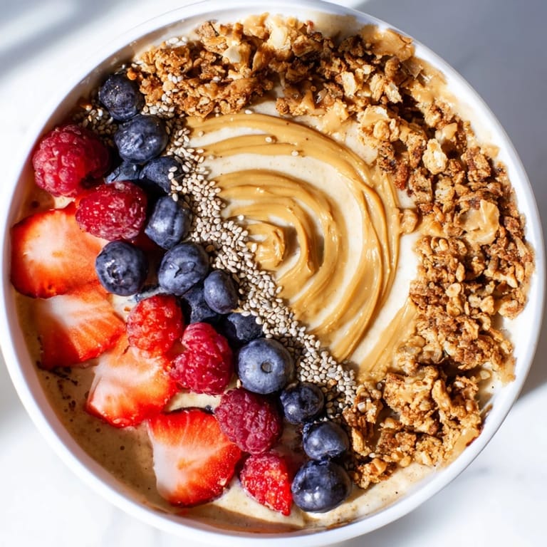 A close-up of a protein ice cream bowl, perfect for a post-workout snack with granola.